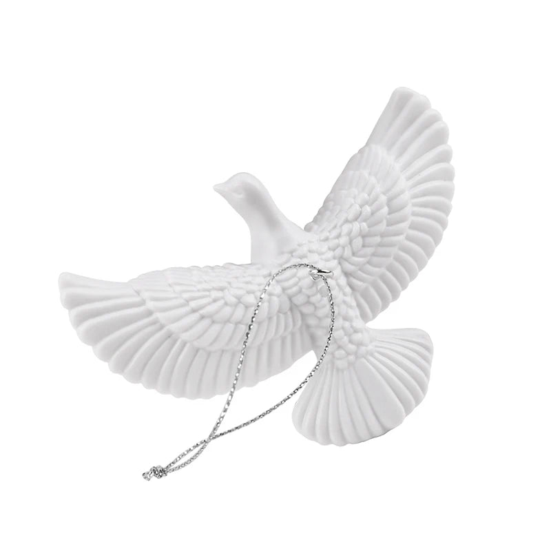 Close-up of handcrafted resin white dove ornament.
