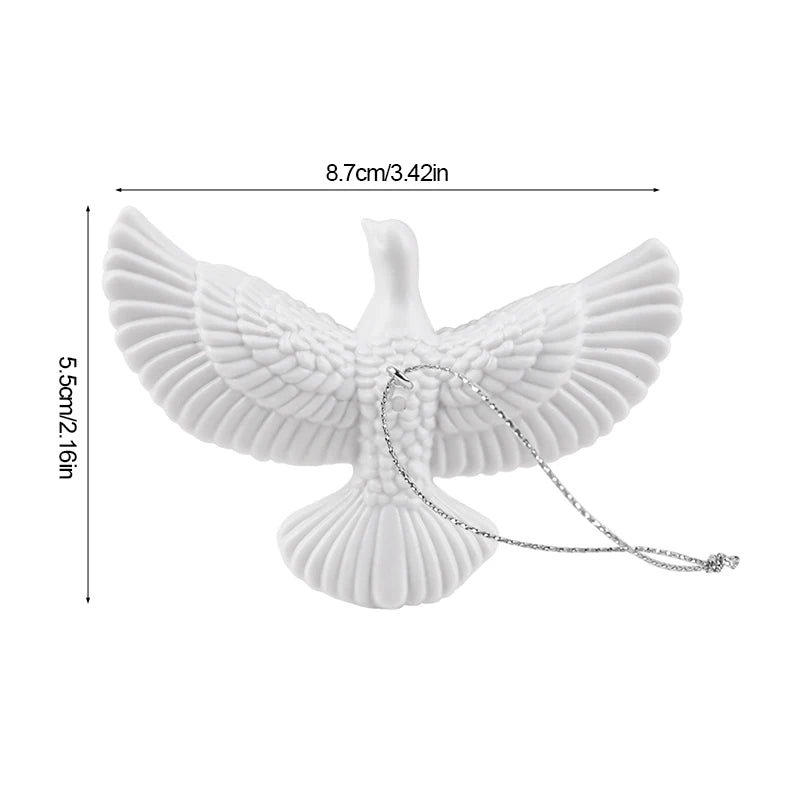 Resin white dove pendants for festive table and wall décor.