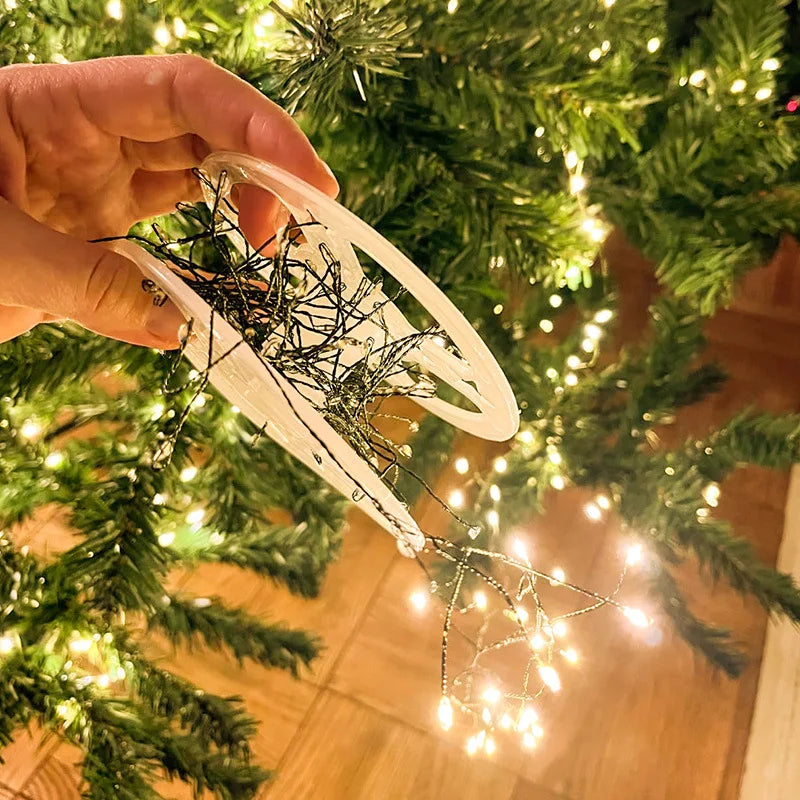 Firecracker LED lights wrapped around Christmas garland.