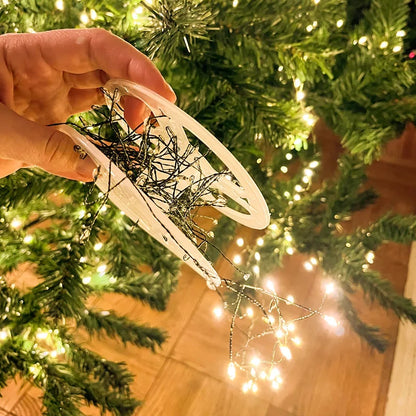 Firecracker LED lights wrapped around Christmas garland.