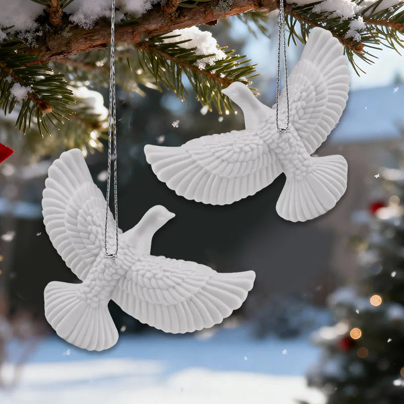 Minimalist dove ornament reflecting warm Christmas lights.