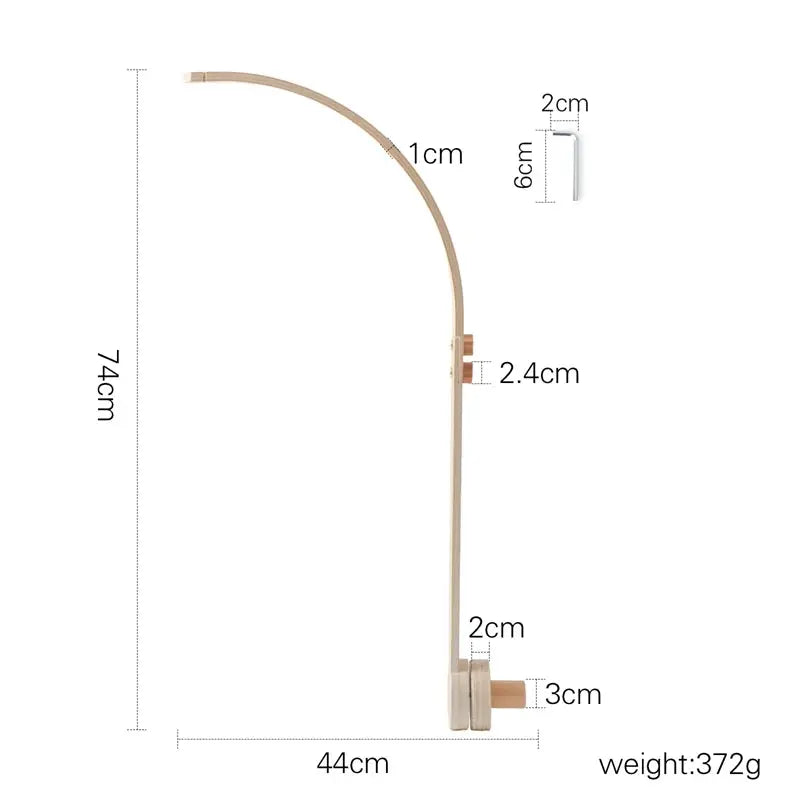 natural wood crib mobile with music box detail
