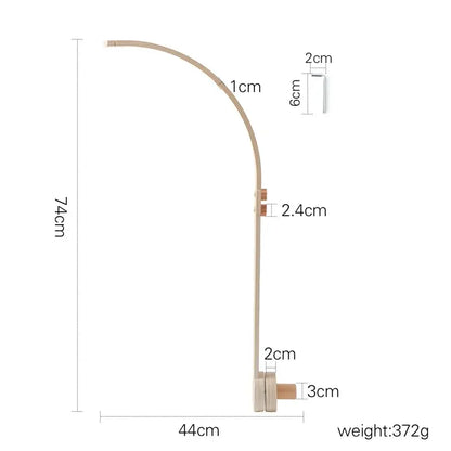 natural wood crib mobile with music box detail
