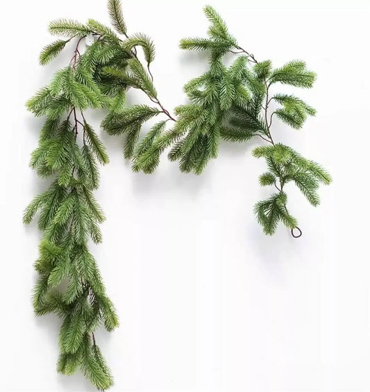 Artificial Christmas garland with pine rattan design hanging on fireplace.