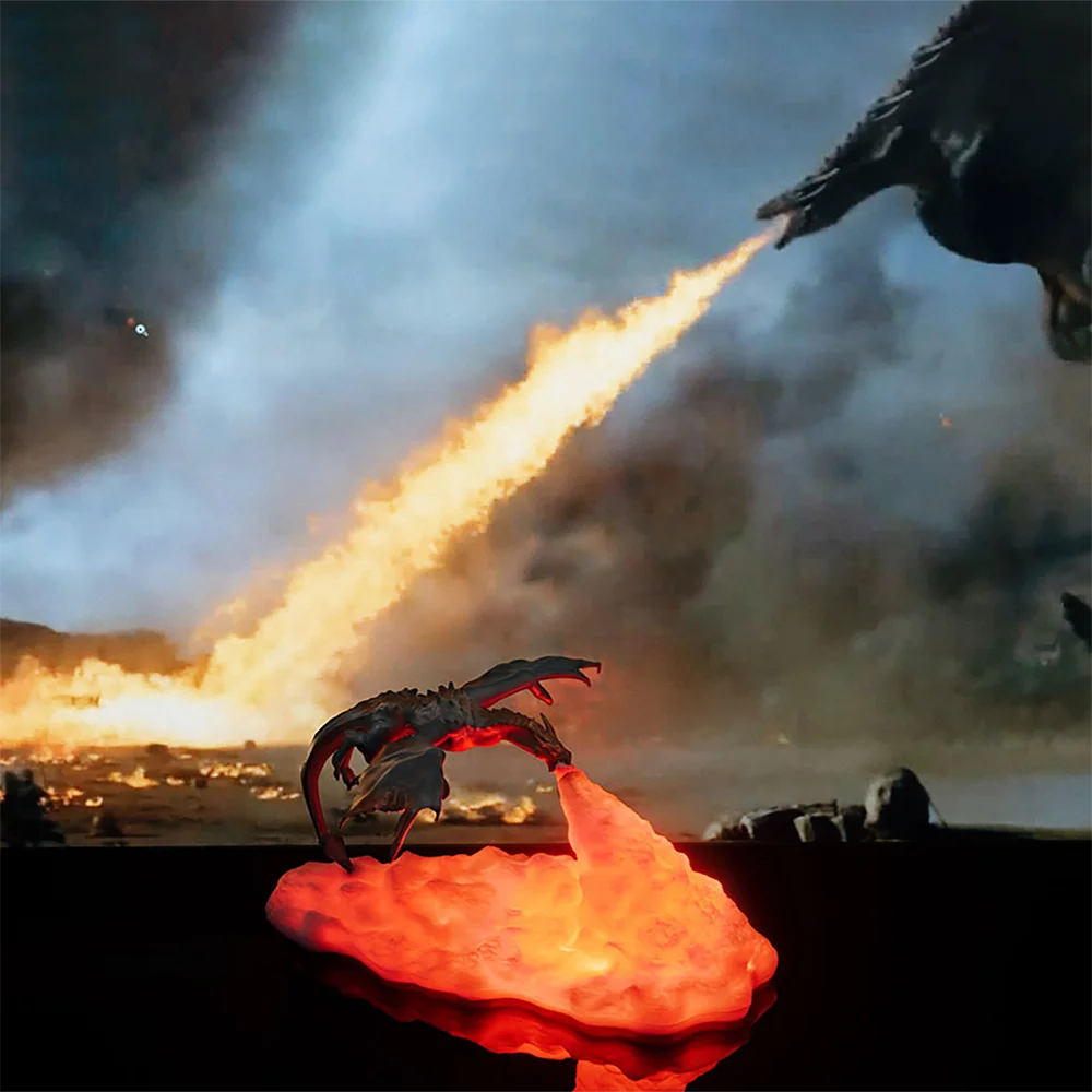 Fire dragon table lamp emitting warm light.